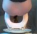 A voyeur, spycam type video clip with full audio showing a woman from overhead taking a dump with full audio.